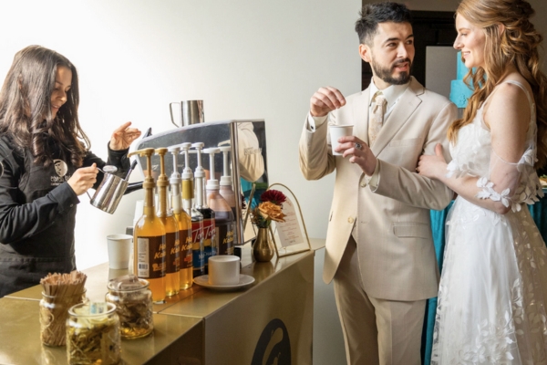 Newlywed couple enjoying the Espresso Dave Coffee Catering experience at their fall wedding reception.