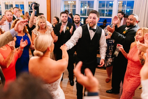 Wedding guests dancing after enjoying drinks from Espresso Dave’s coffee cart