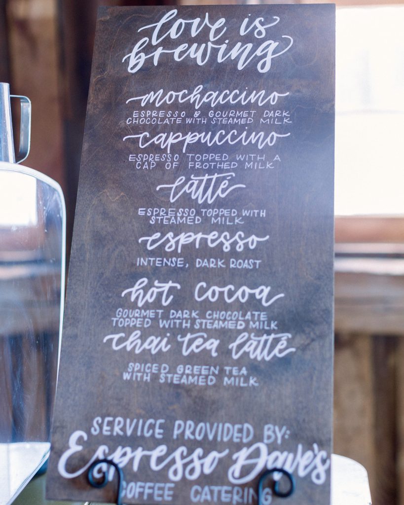 Chalkboard coffee menu at a rustic winter wedding espresso bar, illustrating winter wedding ideas with seasonal drinks provided by Espresso Dave’s Coffee Catering of Boston.