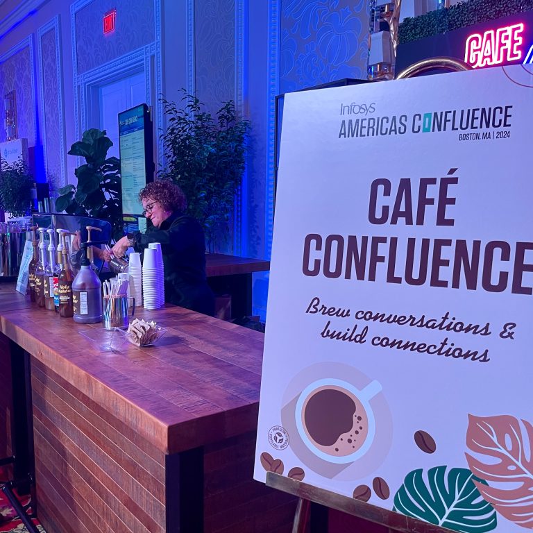 Espresso Dave’s branded coffee catering setup with barista with custom Café Confluence signage at the Infosys Americas Confluence event